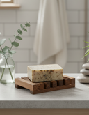 Wooden soap saver in use in natural bathroom setting